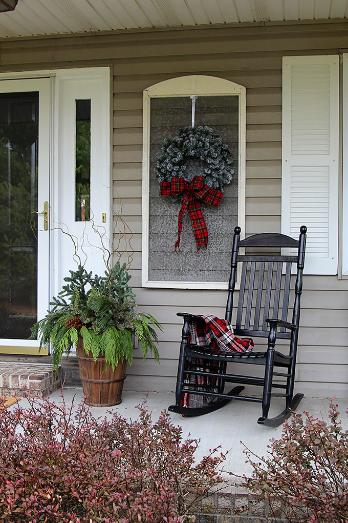 Festive Christmas porch decorations that transition easily from Christmas to winter are found on our rustic, farmhouse, plaid and nature inspired porch.