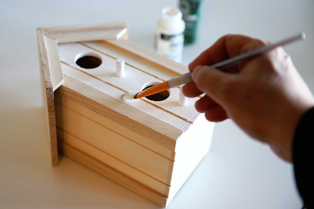 painting a craft store birdhouse