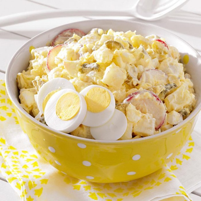 Deli style potato salad with eggs and sliced radish
