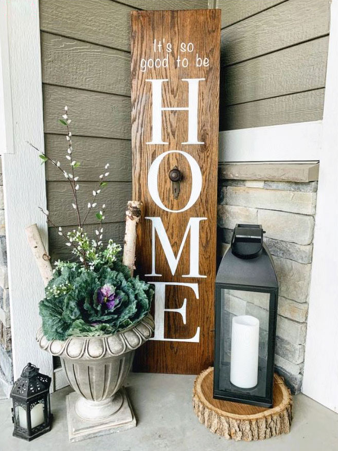 DIY porch leaner sign with the word HOME on it.  