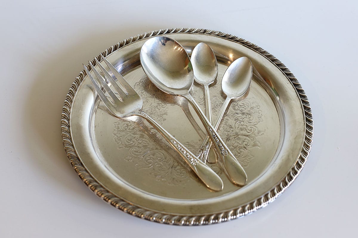 silverware after having been cleaned with the baking soda and aluminum foil method