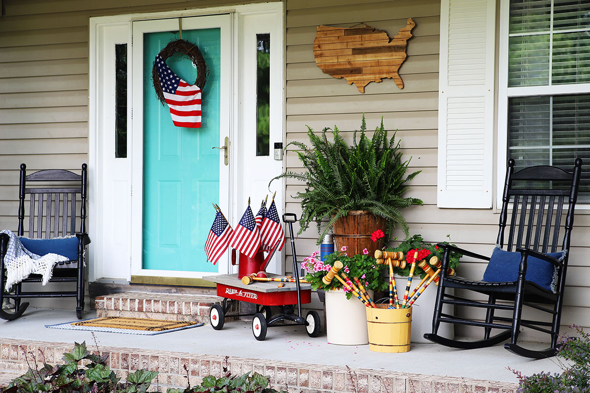 Patriotic porch decor using thrift store finds and items commonly found in your garage or shed. 