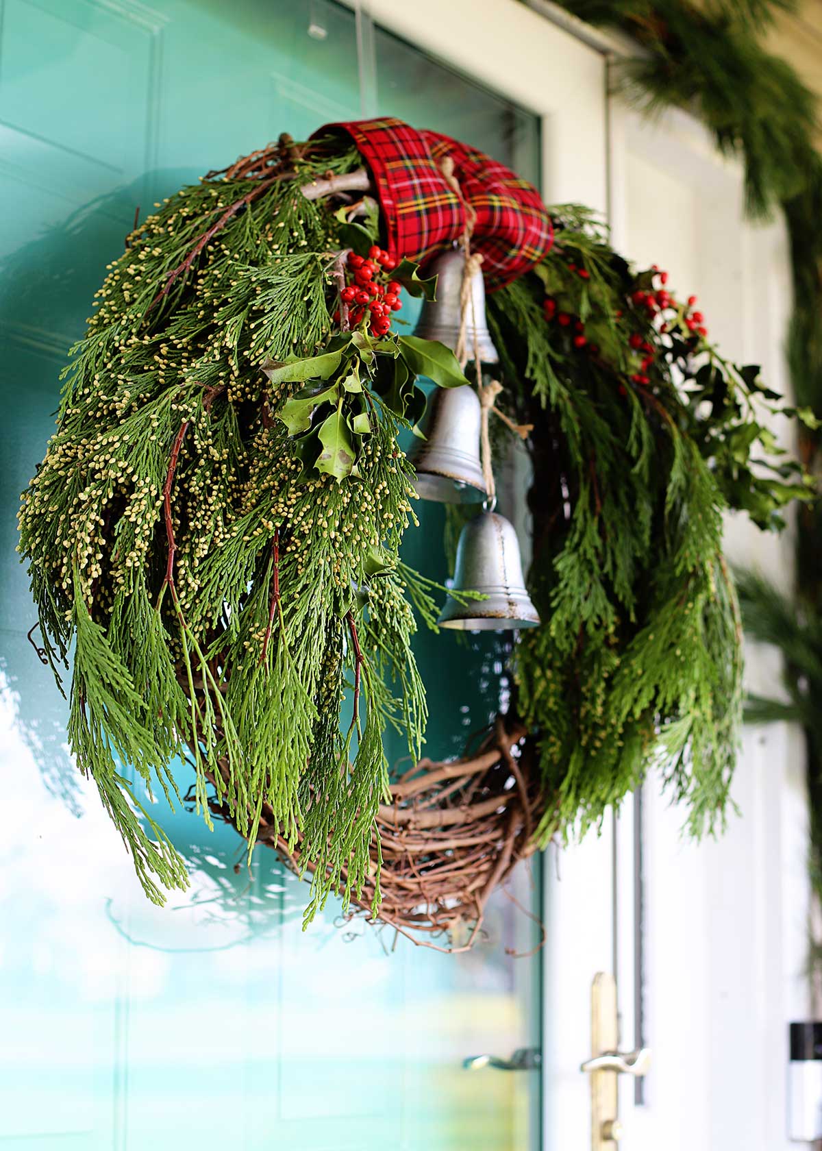 Christmas wreath made with fresh greenery and grapevine 