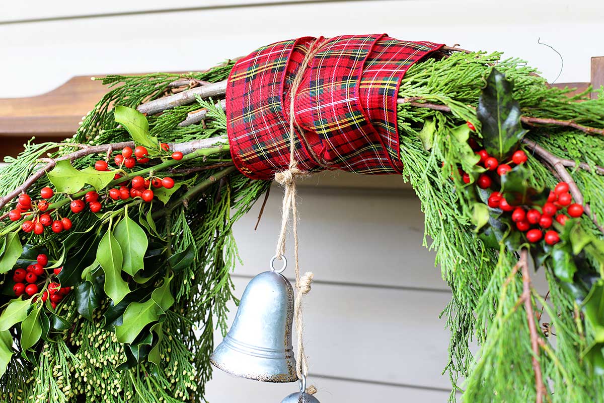 bell hung from evergreen wreath