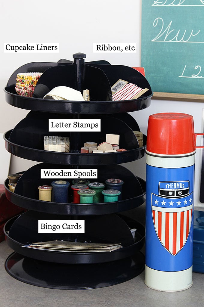 Industrial rotating bins used to organize craft supplies