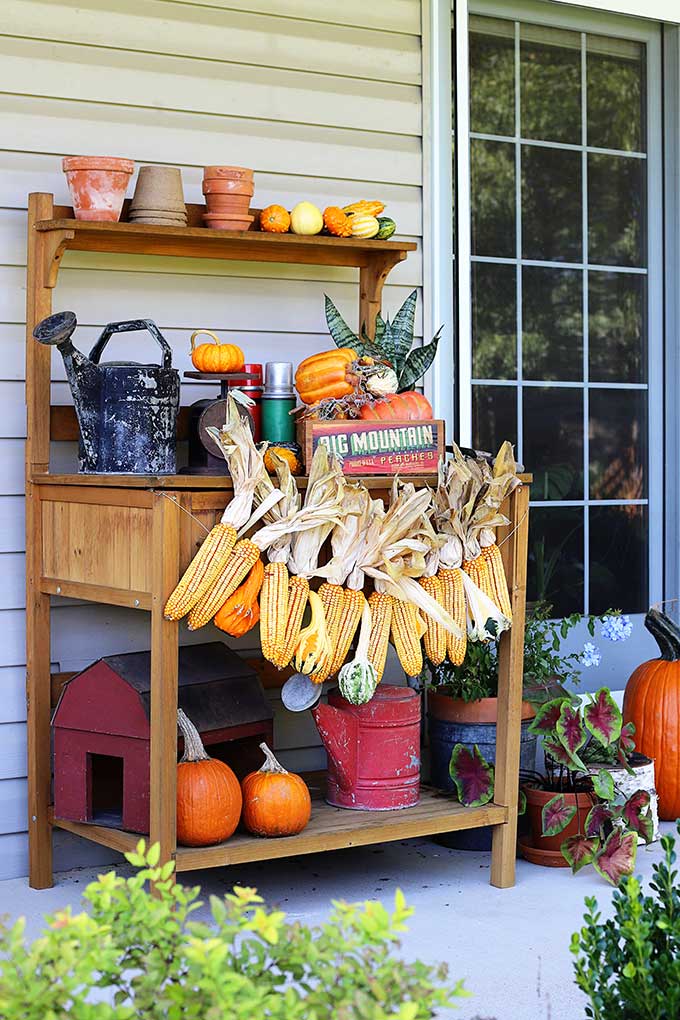 Learn how to make this harvest themed corn garland for fall decor.