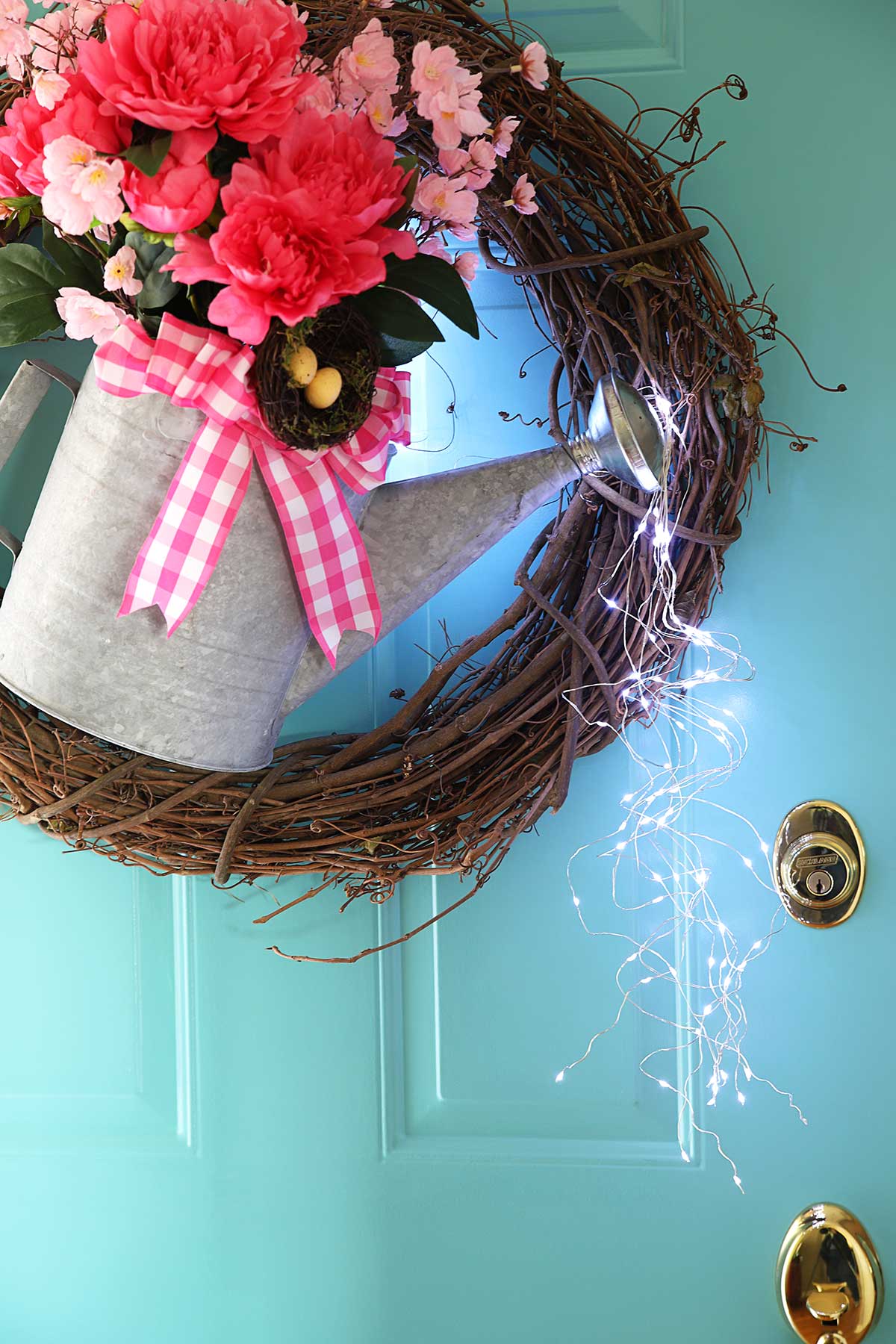 lighted watering can wreath