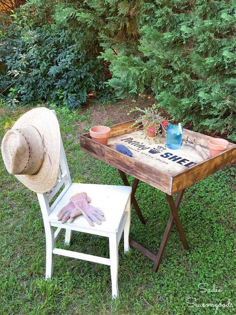 a portable potting bench set up in the yard