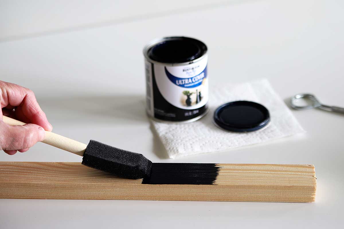 painting wooden frame with black paint