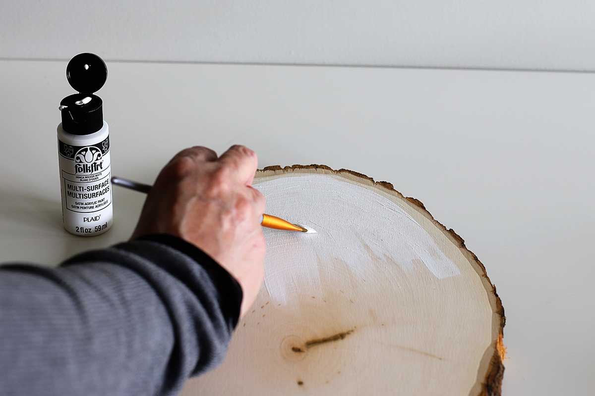 painting wood slice white for crafting