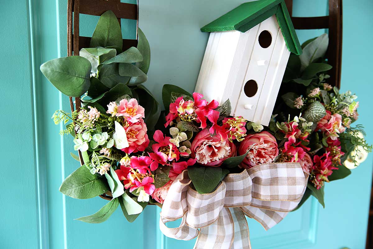 peony wreath for spring with birdhouse and eucalyptus leaves