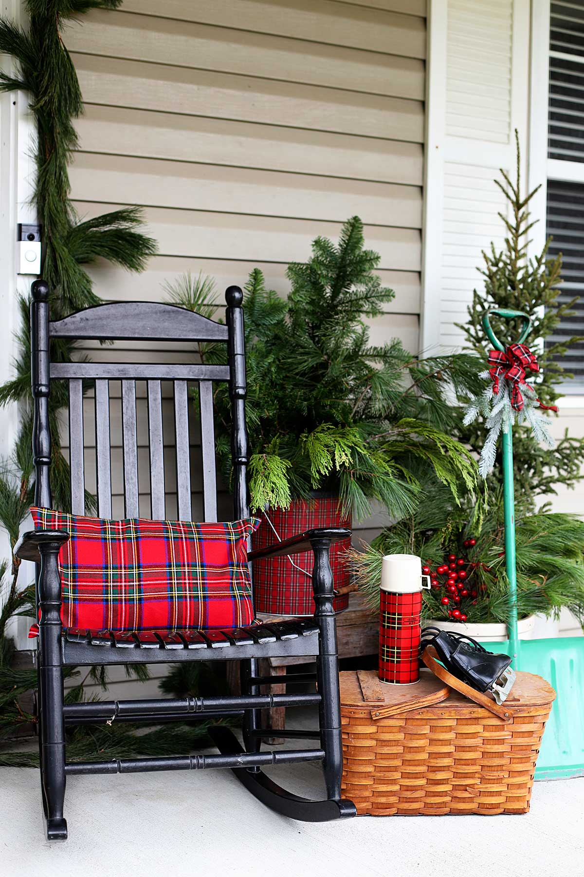 black porch rockers with plaid pillows for Christmas porch decor