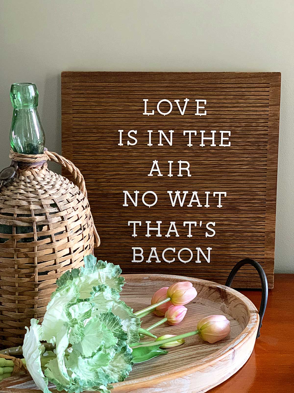 Letter board with the saying - Love is in the air, no wait that's bacon.