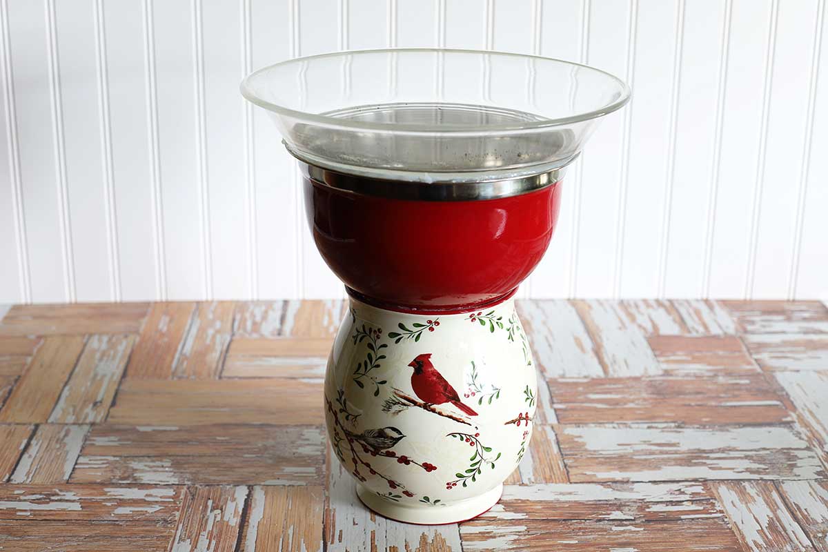 Thrift store kitchenware used to make a bird bath.