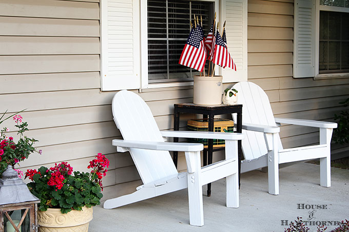 Summer porch decorating ideas and inspiration using farmhouse touches, vintage items, plenty of annual flowers and a healthy dose of patriotic decor. 
