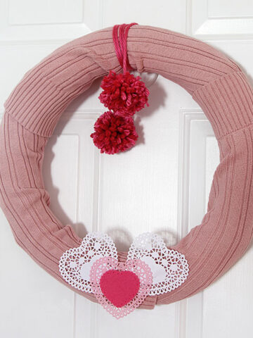 Learn how to make this quick and easy sweater wreath for Valentine's Day. Great way to upcycle your thrift store find.