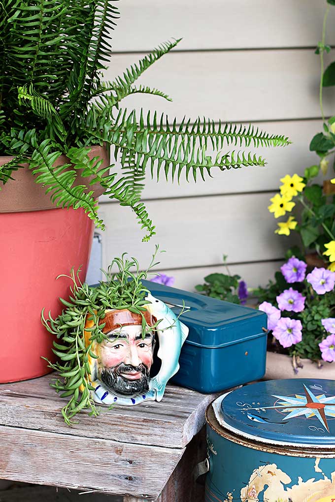 Thrift store fisherman mug repurposed into planter