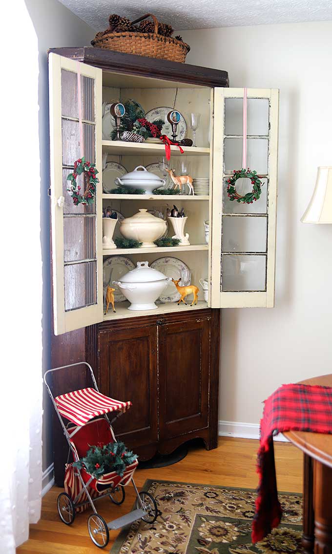 Corner cabinet decorated up for Christmas
