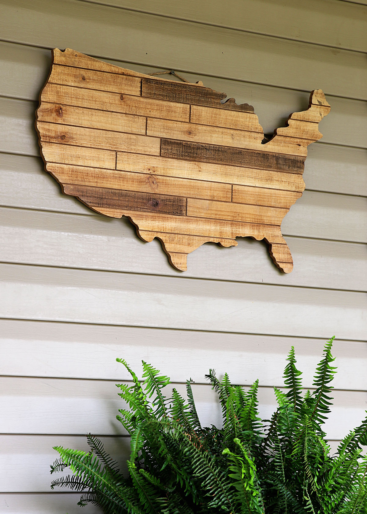 Wooden wall hanging in the shape of the United States. 